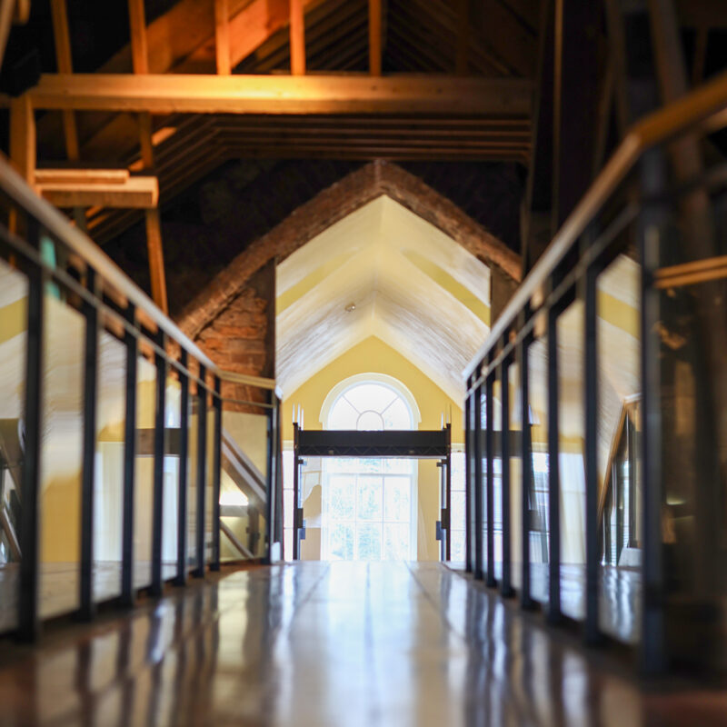 View from attic to staircase and large window