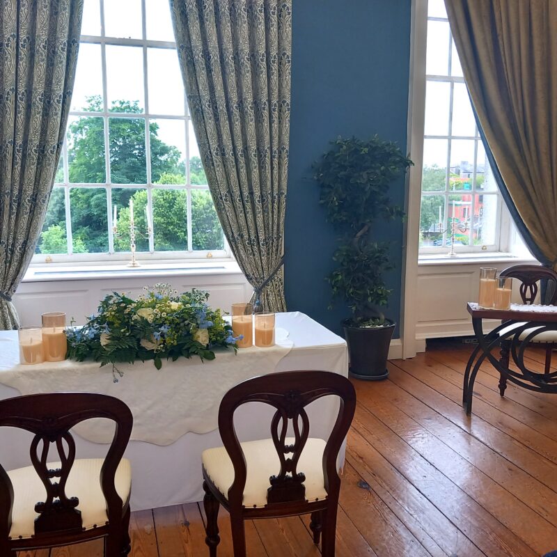 King House Main Salon Wedding altr and signing table with cream Bride & Groom chairs